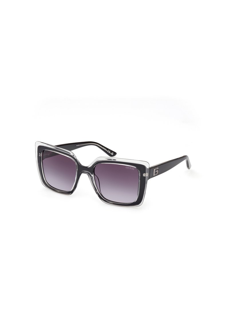 Ochelari de soare supradimensionați, negri și transparenți, cu o formă pătrată. Lentile gradient violet și textură cu model pe rame. Prezintă un detaliu cu logo.