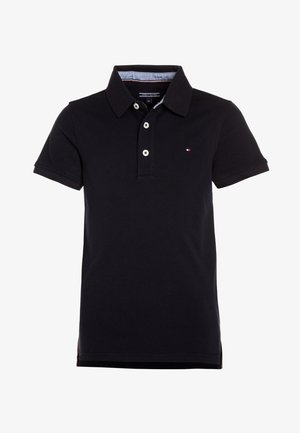 Short-sleeve polo shirt in black cotton with a classic collar, two-button placket, and a small logo on the chest. Side vents at the hem.
