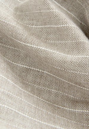 Light brown fabric with a textured surface and white vertical stripes, showcasing a woven pattern and softness.