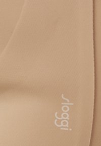 Beige fabric material with a smooth texture, featuring a white logo "sloggi 1991" printed on the bottom left corner.