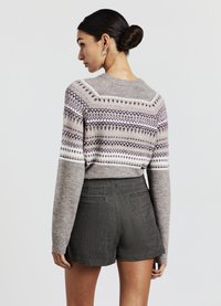Gray knitted sweater with a geometric pattern in cream and dark purple, paired with textured dark gray shorts, viewed from the back.