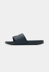 Navy blue slide sandal with a wide strap featuring a logo, made from durable material with a textured sole for grip. Flat design.
