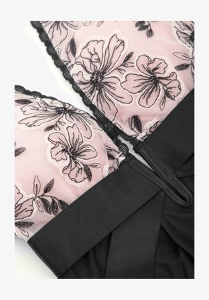 Czarny gorset z różową koronką w kwiaty, z falbaniastymi krawędziami i teksturowanym czarnym materiałem łączącym się na dole. Projekt zawiera detale na ramiączkach.