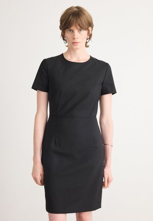 Black fitted dress with short sleeves, round neckline, and a subtle waist seam. Fabric appears smooth with no visible patterns or embellishments.