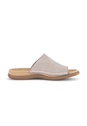 Suede slide sandal in light gray. Features a curved design with stitching detail along the lateral edge and a cushioned tan footbed.