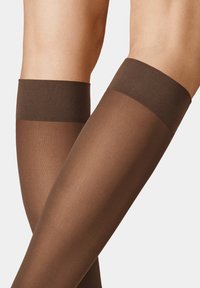 Brown thigh-high stockings with a matte finish and a wide, solid brown band at the top. Smooth texture, sheer design for a streamlined look.