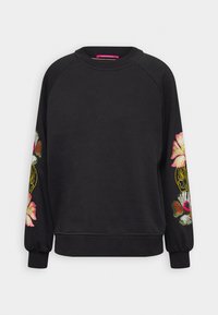 Sudadera negra con mangas raglán largas, con bordado floral colorido en ambas mangas. Tejido suave y puños de canalé.