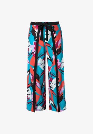 Weit geschnittene Hose mit abstraktem Blumenmuster in Türkis, Rot, Weiß, Schwarz und Pink, mit schwarzen vertikalen Streifen und einem Taillenband zum Binden.