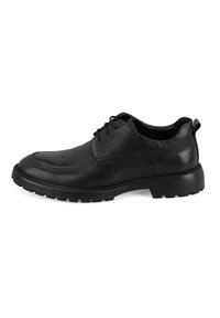 Chaussures en cuir noir avec une finition lisse, bout rond et profil bas. Elles disposent d'une semelle en caoutchouc épaisse et texturée, ainsi que d'un système de laçage.