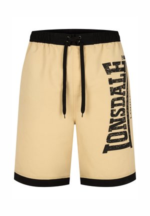 Beige Shorts mit einem schwarzen elastischen Bund und Kordelzug, ausgestattet mit einem großen schwarzen Logo auf der Seite und schwarzen Saumakzenten.