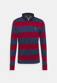 Langärmliges Poloshirt mit horizontalen Streifen in Marineblau und Rot, einem marineblauen Kragen und einem kleinen Logo auf der Brust. Weiches Baumwollmaterial.