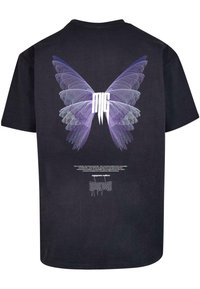 Black cotton t-shirt featuring a large, purple butterfly design on the back with the text "mg" in white and additional text below.