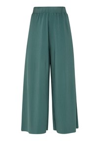 Pantalon vert à jambes larges en tissu côtelé, doté d'une ceinture élastique et d'une coupe ample. Aucun motif supplémentaire ni détail matériel.
