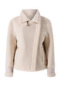 Giacca in pile beige con colletto alto e chiusura con zip. Presenta tasche laterali, una finitura in tessuto liscio e una superficie testurizzata in tutto il capo.