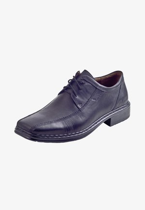 Chaussure habillée en cuir noir avec un bout arrondi, un design à lacets et une couture contrastante. Texture lisse et talon bas.