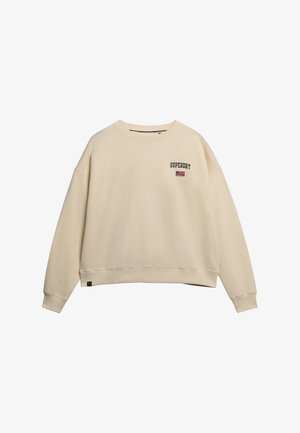 Cremefarvet oversized sweatshirt lavet af blødt stof, med "SUPERDRY" tekst og amerikansk flag logo broderet på brystet.