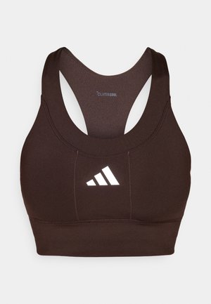 Rjava športna modrček z racerback zasnovo in odsevnim belim logotipom spredaj. Narejena iz zračnega materiala za udobje.