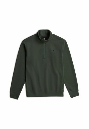 Sweatshirt à col haut de couleur vert foncé avec une fermeture éclair quart. Présente une surface texturée et un petit logo sur la poitrine.