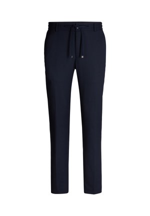Marineblauwe joggers met een trekkoord in de taille, taps toelopende benen en een zachte, gladde textuur. Beschikt over een minimalistisch ontwerp en geen zichtbare patronen.