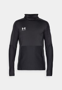 Black long-sleeve athletic top with a high collar, textured fabric, and contrasting matte sections. Features the Under Armour logo in white.