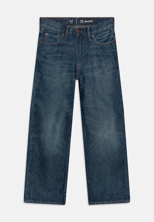 Pohodlné modré džíny z denimu s pěti kapsami, viditelným šitím, zapínáním na knoflík a mírně vybledlou strukturou.