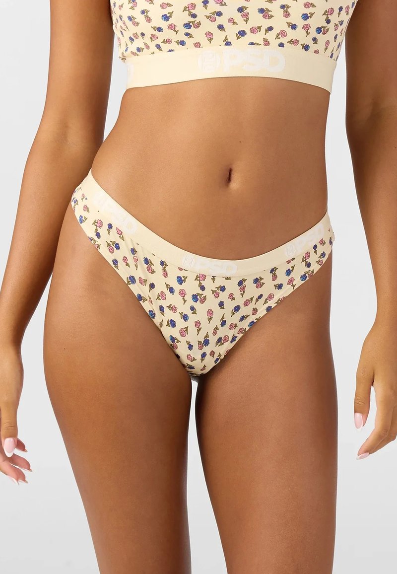 Beige tanga undertøy med blomstermønster som har en myk midjebånd med logo, laget av et glatt strekkstoff for komfort.