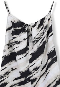 Robe sans manches à motifs noir et blanc avec des bretelles réglables, présentant un col à cordon de serrage et un tissu léger.