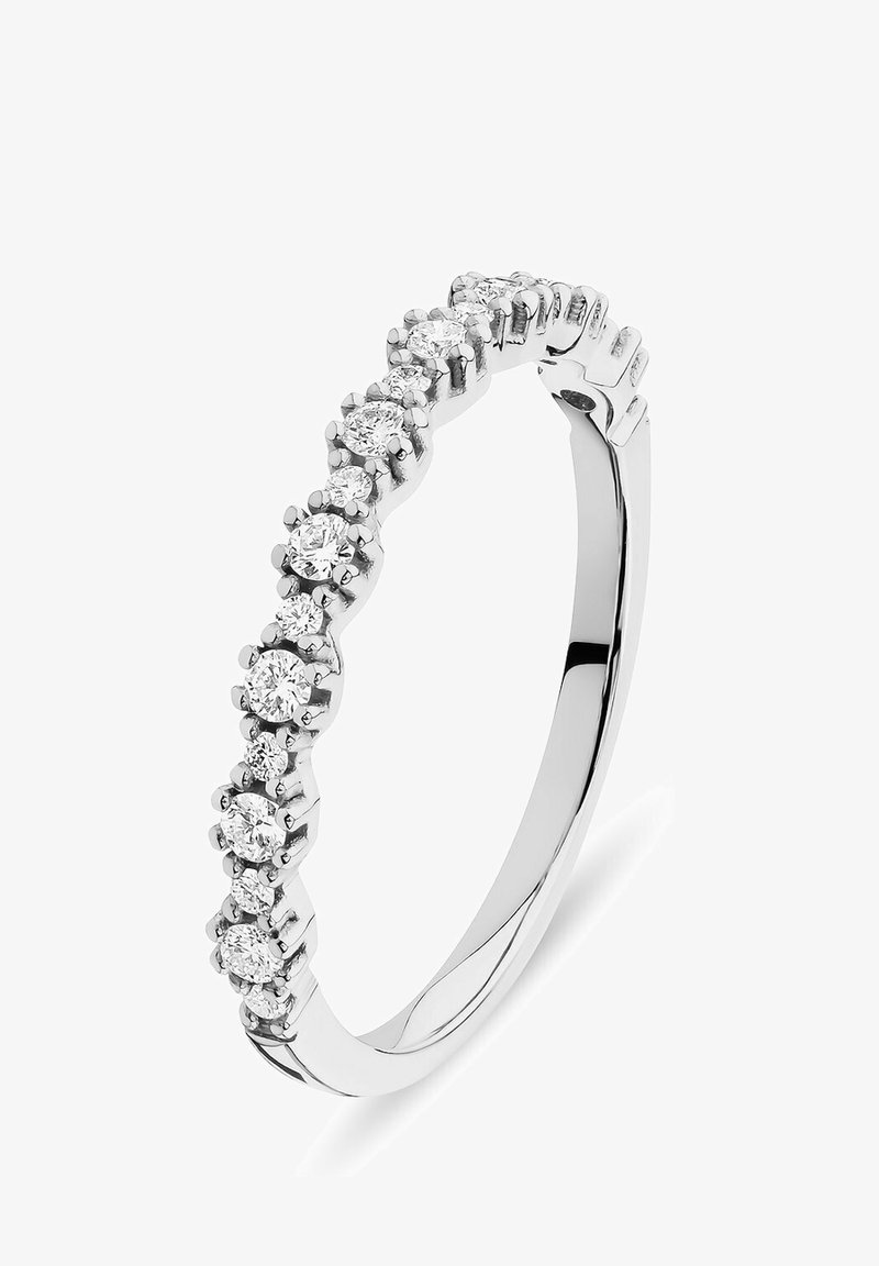 White gold ring featuring a row of evenly spaced round diamonds, set in a low-profile prong setting, with a smooth, polished band.