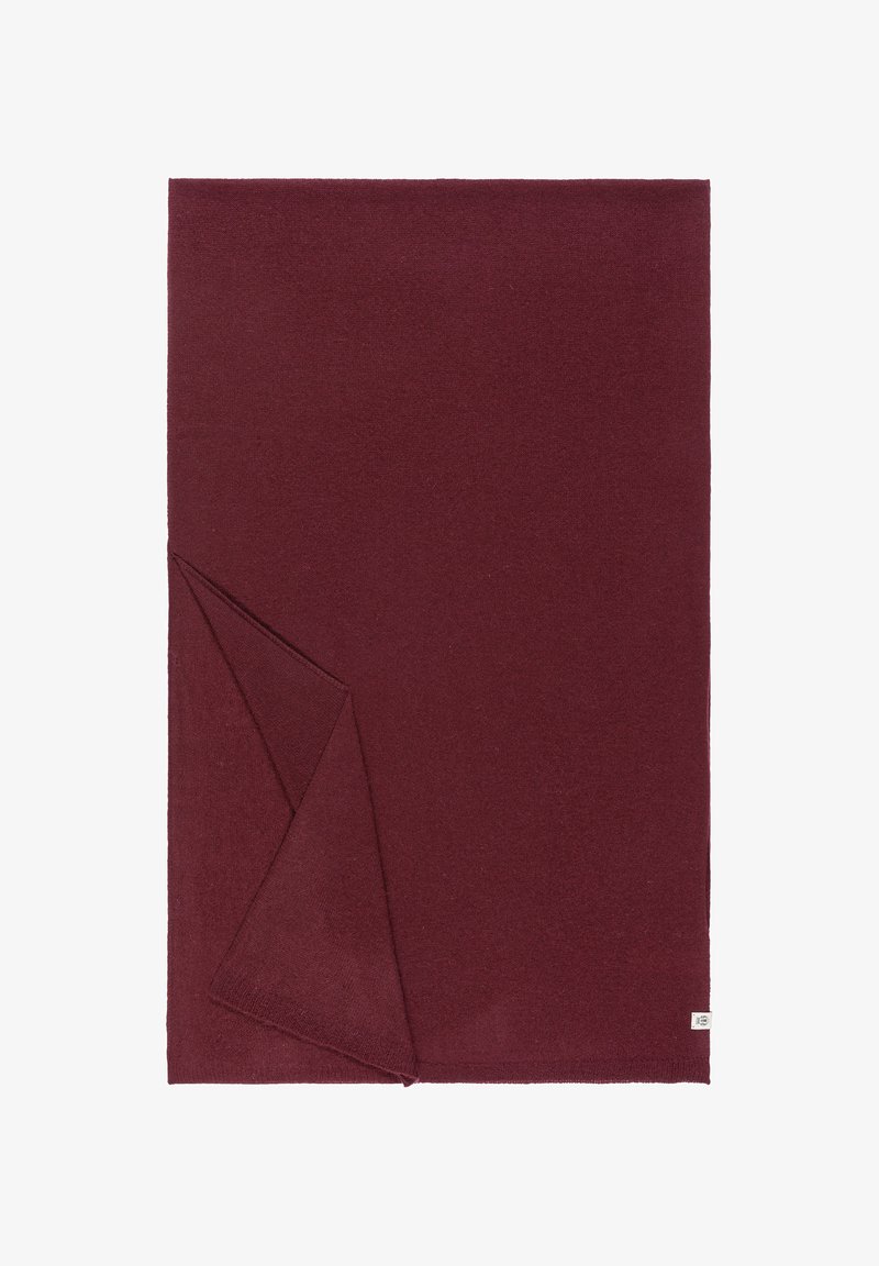 Burgundy blanket made of soft fabric, featuring a folded corner, clean edges, and a small label on one side. Smooth texture, solid color.