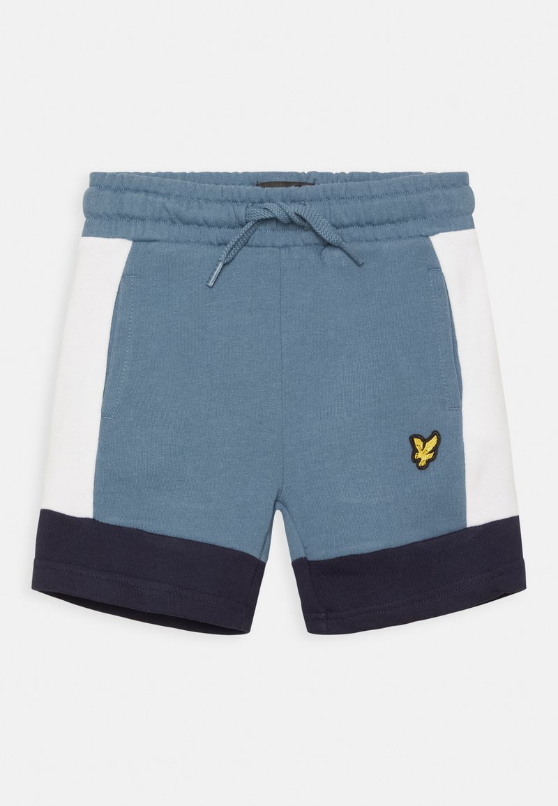 Calções de algodão azuis com painéis laterais brancos e bainha azul-marinho. Apresenta uma cintura elástica com cordão e um logótipo amarelo na parte da frente.