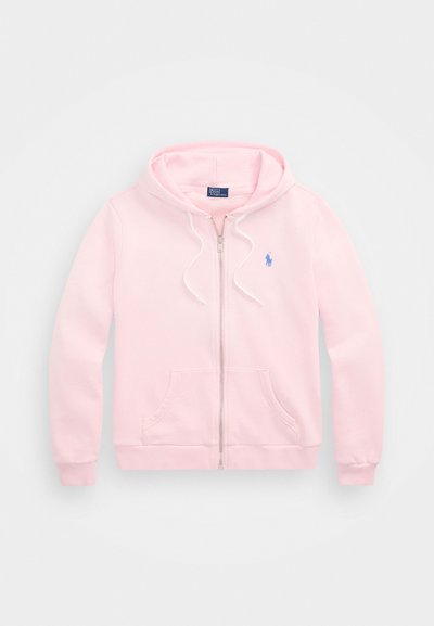 Svetloružová mikina na zips vyrobená z bavlnenej zmesi, s predným zipsom, šnúrkami na kapucni a vyšitým modrým logom na hrudi.