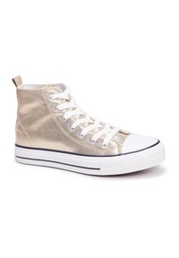 Gold high-top sneaker with a metallic finish, white rubber toe cap, and laces. Features a textured surface and contrasting navy stripe on the sole.