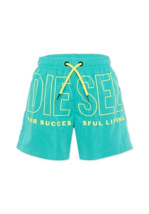 Costume da bagno turchese con cordino giallo e grande scritta logo Diesel gialla, inclusa la frase parziale "FOR SUCCESSFUL LIVING" sulla parte anteriore.