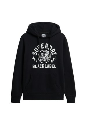 Felpa nera con cappuccio, tasca frontale e cappuccio regolabile tramite cordino. La scritta bianca presenta "Superdry" e una grafica di teschio. Tessuto misto cotone.