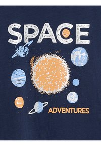 Navy t-shirt with "SPACE" in white and "ADVENTURES" in orange. Features colorful planets and sun illustrations in various sizes.