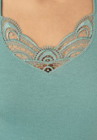 Damart FINITION  - Camiseta estampada - vert