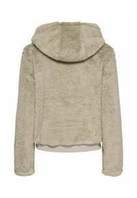 Gekürzte, kapuzenjacke aus weichem, strukturiertem beigem Fell, mit einem gerippten Saum und Bündchen. Glattes, plüschiges Material ohne sichtbare Verschlüsse.