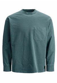 Långärmad T-shirt i bomull med rund halsringning, teal-färgad, med framficka. Har ribbstickade muddar och fåll för extra struktur.