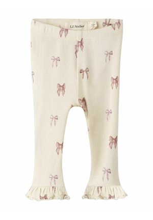 Geribbelde crèmekleurige legging met roze strikpatronen en gerimpelde manchetten. Gemaakt van zachte stof, geschikt voor casual gebruik.