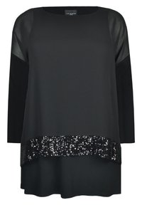 Svart topp med långa ärmar, rund ringning och paljettdetaljer vid nederkant. Tyget är mjukt med transparenta axelaccenter.