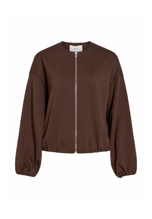 Giacca marrone con zip, collo arrotondato e maniche oversize a sbuffo. Realizzata in tessuto morbido, presenta un'orlo a coste in vita.