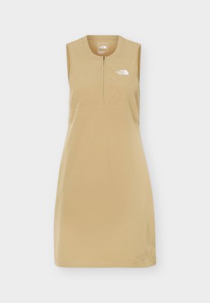 Vestido sin mangas de color beige tostado con cremallera frontal y logo blanco de The North Face en el pecho, diseñado para uso casual o al aire libre.
