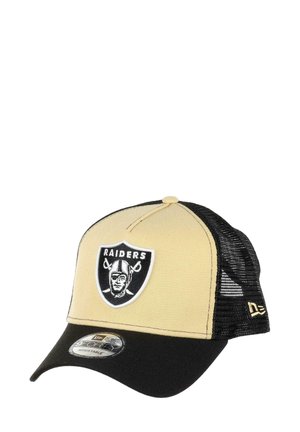 Trucker hat with khaki front, black mesh sides, and adjustable back. Features a Raiders logo patch in black and white on front.