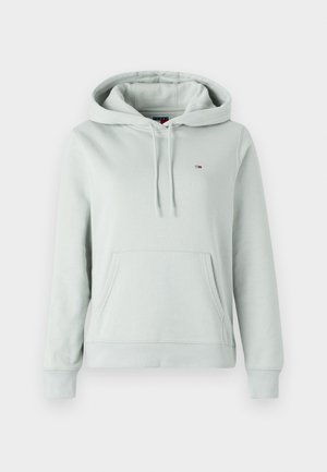 Hellgrüner Hoodie aus weichem Material, ausgestattet mit einer Vordertasche, Kapuze mit Kordelzug und einem kleinen Logo mit roten, weißen und blauen Akzenten.