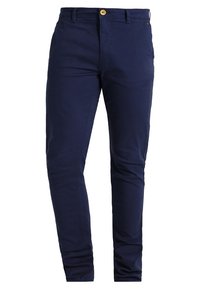 Námořnické modré chinos kalhoty vyrobené z bavlny, s úzkým střihem, předními kapsami a zlatým knoflíkem na zapínání. Hladká textura a minimalistický design.