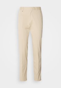 Pantalon beige slim fit avec passants de ceinture, fermeture éclair devant et poches latérales, présenté sur un fond blanc uni.