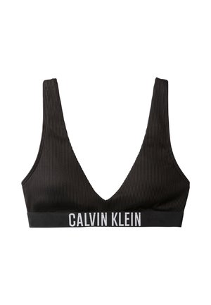 Zwart geribbeld bralette van zachte stof met diepe V-halslijn en brede band met het "CALVIN KLEIN" logo in witte letters.