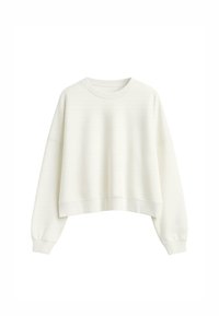 Sudadera recortada de color crema con mangas largas, escote redondo y puños de canalé. Tejido suave con una textura sutil.
