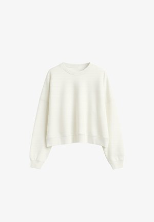 Cropped cream sweatshirt with long sleeves, round neckline, and ribbed cuffs. Soft fabric with a subtle texture.