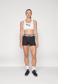 Puma KEEPS BRA - Športni modrček s srednjo podporo - white